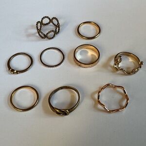 Lot of nine gold/brass colored rings